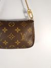 Bolsa Louis Vuitton Pochette Monograma Mini