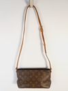 Bolsa Louis Vuitton Trotteur Monogramado