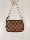 Bolsa Louis Vuitton Pochette Damier Ebene