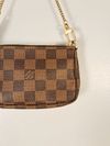 Bolsa Louis Vuitton Pochette Damier Ebene