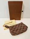 Bolsa Louis Vuitton Pochette Damier Ebene