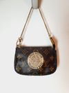 Bolsa Louis Vuitton Pochette Accessoires Mini 