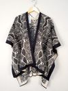 Poncho em tricot reversível