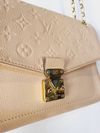 Bolsa Pochette Métis - Monogram Empreinte Louis Vuitton 