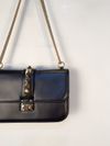 Bolsa Valentino Glam Lock Rockstud Medium 