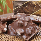 Lascas Macadâmia com Chocolate Meio Amargo