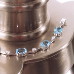 PULSEIRA FIO FACA TOPÁZIO SKY OVAL E MOISSANITE PRATA
