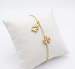 PULSEIRA INFANTIL REGULAVEL URSO E LAÇO ROSA COM RESINA BANHADA EM OURO 18K