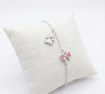 PULSEIRA INFANTIL REGULAVEL URSO E LAÇO ROSA COM RESINA BANHADA EM PRATA 925
