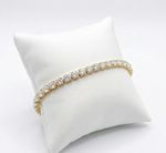 PULSEIRA REGULAVEL RIVIEIRA CRAVEJADO COM ZIRCÔNIAS LILAS BANHADO A OURO 18K