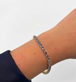 PULSEIRA REGULÁVEL RIVIERA CRAVEJADA COM ZIRCÔNIAS LILÁS BANHADO EM OURO 18K