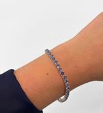 PULSEIRA REGULÁVEL RIVIERA CRAVEJADA COM ZIRCÔNIAS LILÁS BANHADO EM PRATA 925