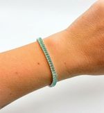 PULSEIRA REGULÁVEL RIVIERA CRAVEJADA COM ZIRCÔNIAS VERDE BANHADO EM PRATA 925