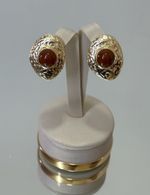 Brinco orgânico dourado com marrom