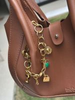 Charm e Pulseira Viagem Ouro