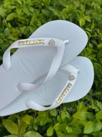 Havaianas Top Branca + Escrita Dourada + Coração de Strass