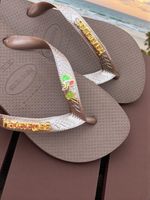Havaianas Top Cafe+ Escrita Dourada + Coco + Coqueiro