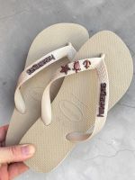 Havaianas Top Areia + Escrita Marrom + Âncora, Tartaruga e Estrela Marrom