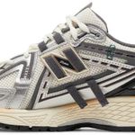 Tênis New Balance 1906A Silver Gold Metallic