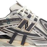 Tênis New Balance 1906A Silver Gold Metallic