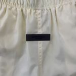 Bermuda Fear of God Essentials Nylon Running Shorts Cream
