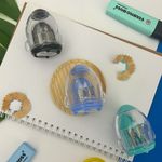 Apontador com Depósito e Tampa Foguete 2 Furos (Azul, Verde e Preto) - Yins