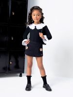 Blusa em laise e short saia