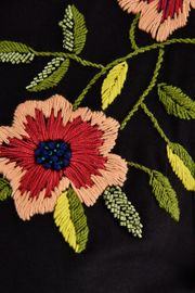 CAMISETA WHIRL COM BORDADO