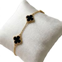 Foto do produto PULSEIRA REGULÁVEL 3 TREVOS BLACK BANHADO EM OURO 18K