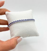 Foto do produto PULSEIRA REGULÁVEL RIVIERA CRAVEJADA COM ZIRCÔNIAS LILÁS BANHADO EM PRATA 925