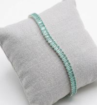 Foto do produto PULSEIRA REGULÁVEL RIVIERA CRAVEJADA COM ZIRCÔNIAS VERDE BANHADO EM PRATA 925