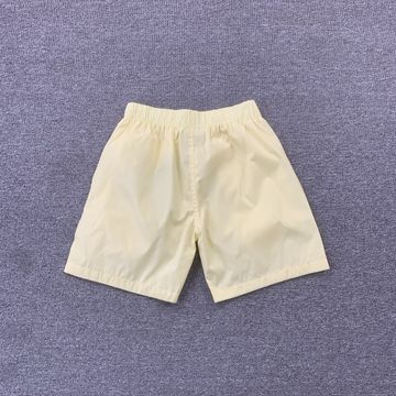 Foto do produto Bermuda Fear of God Essentials Nylon Running Shorts Cream