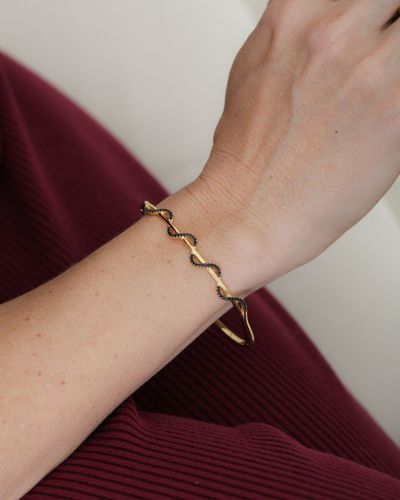 Bracelete aro rígido ondulado com zircônia negras