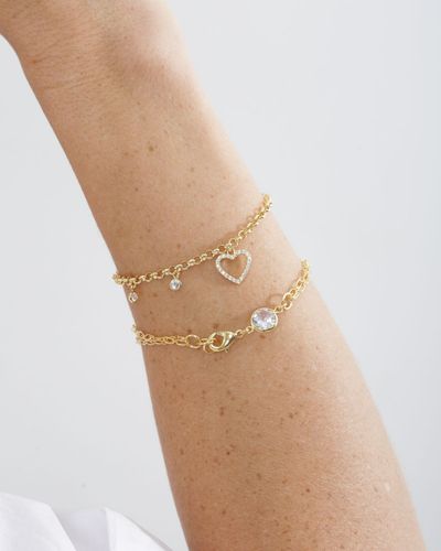 Pulseira dourada dupla de elos com ponto de luz