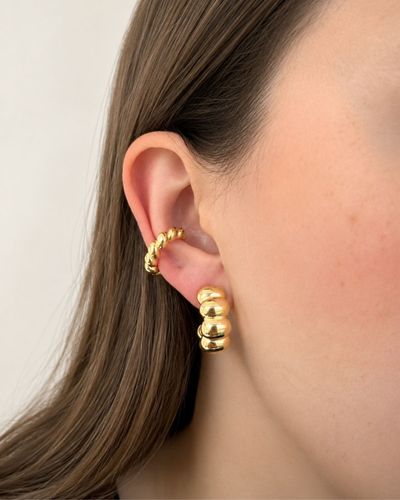 Piercing fake torcido dourado