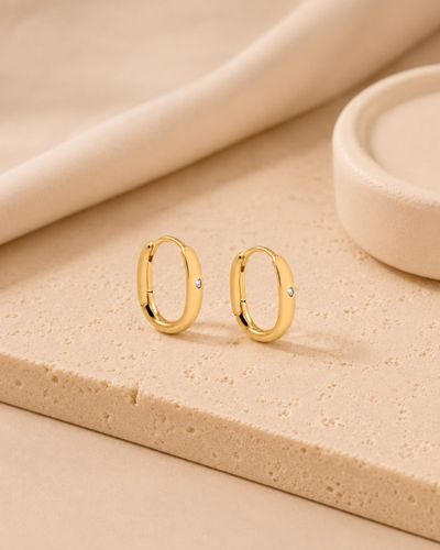 Argola Oval Ponto de Luz banhada a ouro 18k