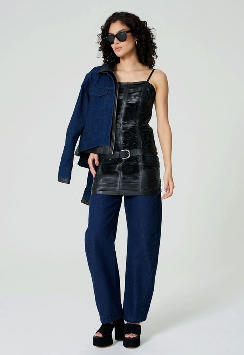 Leather mini skirt over dark jeans